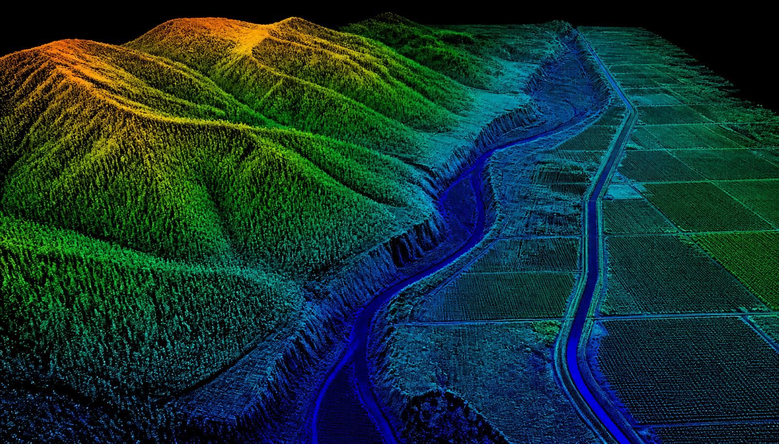 Idaho forested mountain slopes, a river canyon, and an irrigated valley rendered as a colorized aerial LiDAR point cloud